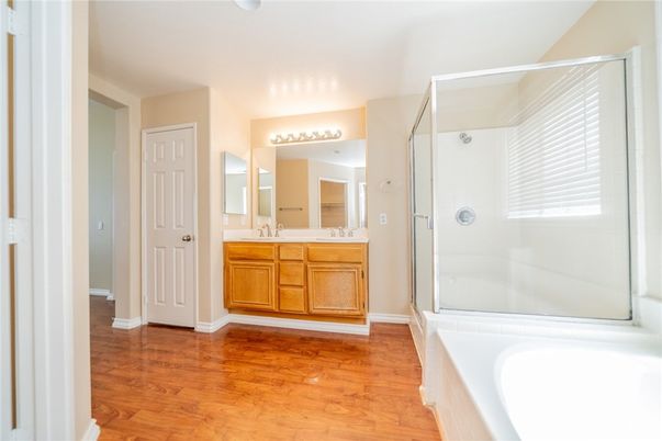 Bathroom, Dual Sink Vanities, Glass Shower, Interior, Wood Texture Flooring