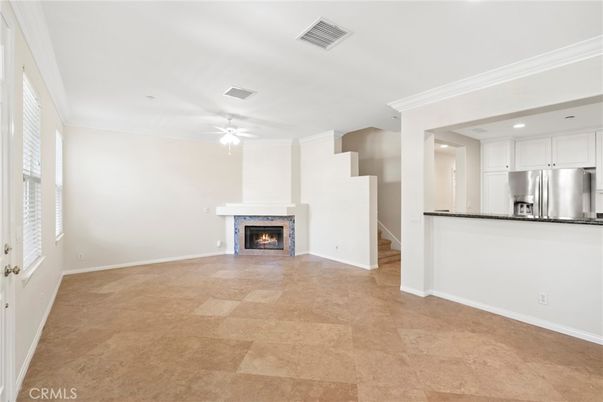 Empty room, Fireplace, Interior, Kitchen, Recessed Lighting, Stainless Steel Appliances