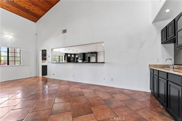 Empty room, Interior, Kitchen, Recessed Lighting, Stainless Steel Appliances, Wooden Ceilings