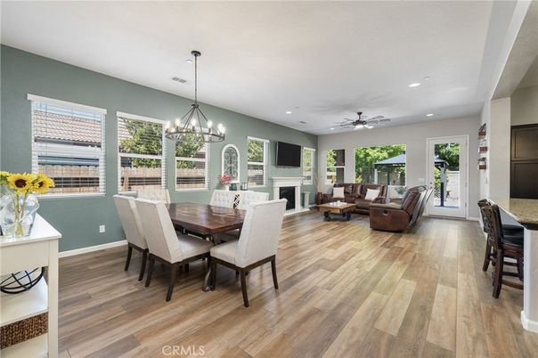 Chandelier, Dining room, Fireplace, Interior, Living room, Recessed Lighting, Wood Texture Flooring
