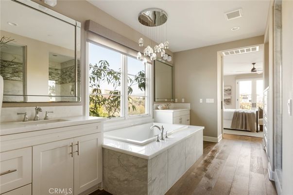 Bathroom, Dual Sink Vanities, Interior, Pendant Lights, Recessed Lighting, Wood Texture Flooring