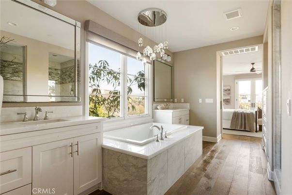 Bathroom, Dual Sink Vanities, Interior, Pendant Lights, Recessed Lighting, Wood Texture Flooring