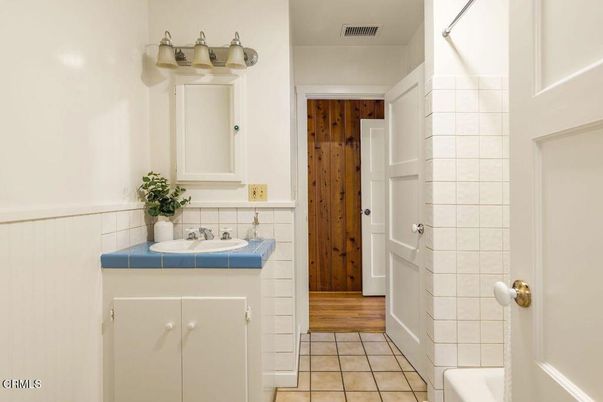 Bathroom, Interior, Tile Countertops, Wood Texture Flooring, Wooden Walls