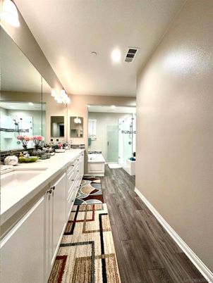 Bathroom, Dual Sink Vanities, Glass Shower, Interior, Recessed Lighting, Wood Texture Flooring