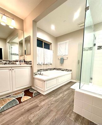 Bathroom, Dual Sink Vanities, Glass Shower, Interior, Recessed Lighting, Wood Texture Flooring