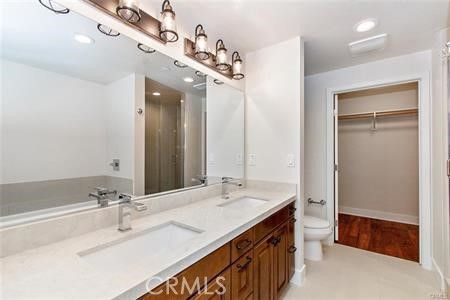Bathroom, Dual Sink Vanities, Interior, Recessed Lighting, Walk-in Closets, Wood Texture Flooring