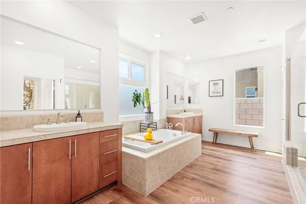 Bathroom, Dual Sink Vanities, Glass Shower, Interior, Recessed Lighting, Wood Texture Flooring