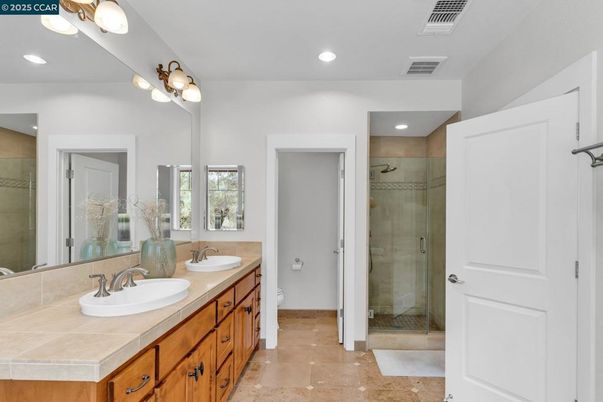 Bathroom, Dual Sink Vanities, Glass Shower, Interior, Recessed Lighting, Tile Countertops