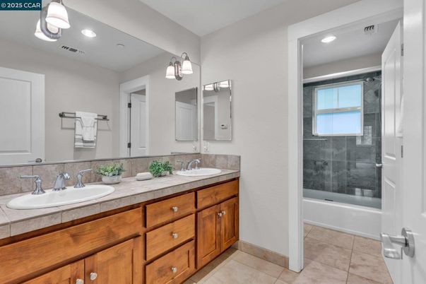 Bathroom, Dual Sink Vanities, Glass Shower, Interior, Recessed Lighting, Tile Countertops
