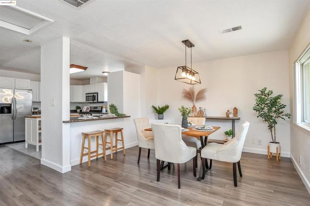 Dining room, Interior, Kitchen, Pendant Lights, Stainless Steel Appliances, Wood Texture Flooring