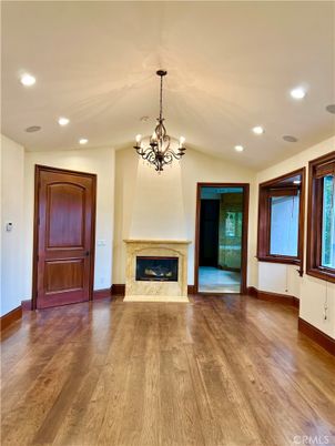 Chandelier, Empty room, Fireplace, Interior, Recessed Lighting, Wood Texture Flooring