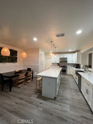 Dining room, Interior, Kitchen, Pendant Lights, Recessed Lighting, Stainless Steel Appliances, Wood Texture Flooring