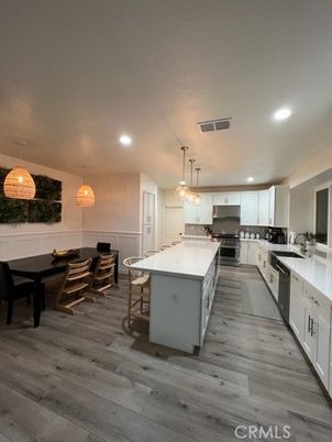 Dining room, Interior, Kitchen, Pendant Lights, Recessed Lighting, Stainless Steel Appliances, Wood Texture Flooring