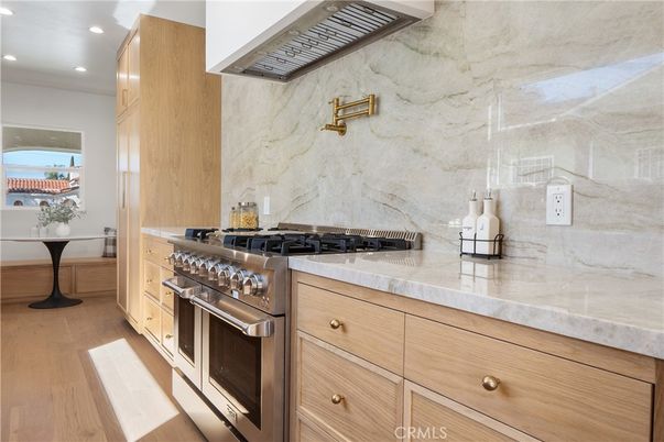 Interior, Kitchen, Marble Walls, Recessed Lighting, Stainless Steel Appliances, Wood Texture Flooring
