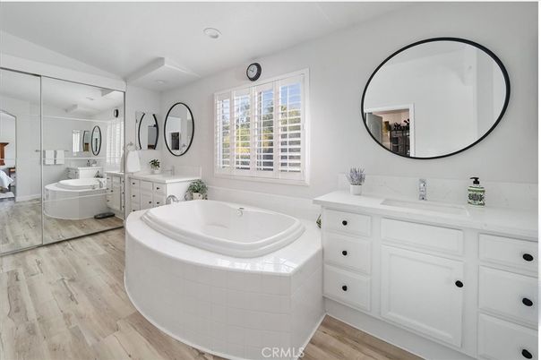 Bathroom, Dual Sink Vanities, Interior, Recessed Lighting, Wood Texture Flooring