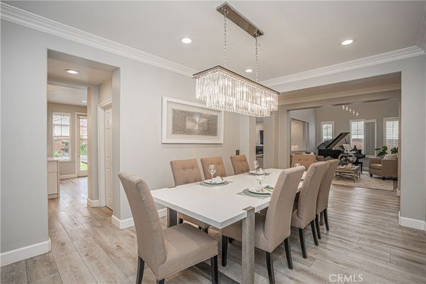 Chandelier, Dining room, Interior, Living room, Piano, Recessed Lighting, Wood Texture Flooring