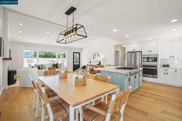 Dining room, Fireplace, Interior, Kitchen, Living room, Pendant Lights, Recessed Lighting, Stainless Steel Appliances, Wood Texture Flooring