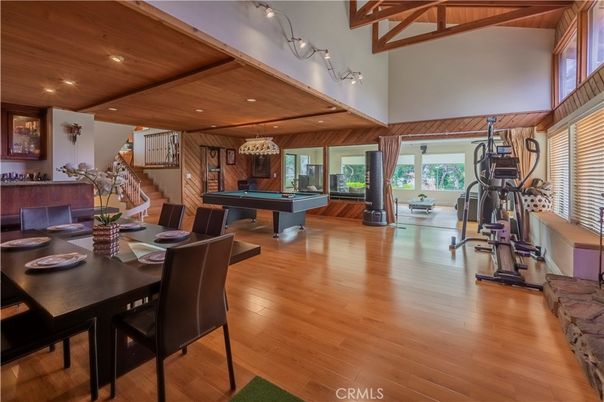 Billiard Table, Chandelier, Dining room, Fitness Equipment, Game Room, Interior, Recessed Lighting, Wooden Beams, Wooden Ceilings, Wood Texture Flooring