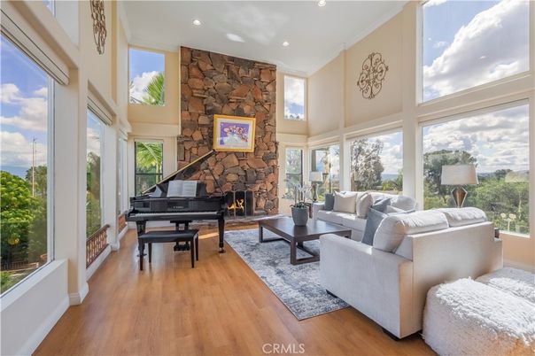 Fireplace, Interior, Living room, Piano, Recessed Lighting, Stone Walls, Wood Texture Flooring