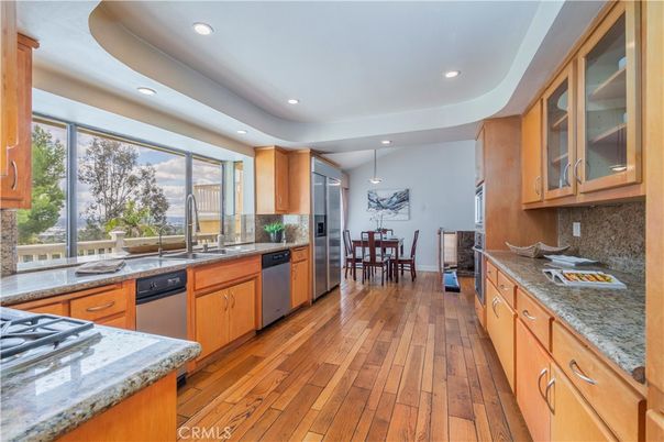 Dining room, Interior, Kitchen, Pendant Lights, Recessed Lighting, Stainless Steel Appliances, Wood Texture Flooring