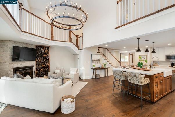 Dining room, Fireplace, Interior, Kitchen, Living room, Pendant Lights, Recessed Lighting, Stainless Steel Appliances, Stone Walls, Wood Texture Flooring