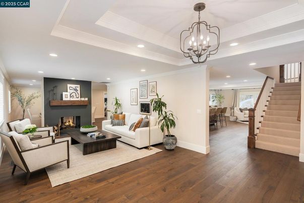Chandelier, Dining room, Fireplace, Interior, Living room, Recessed Lighting, Wood Texture Flooring