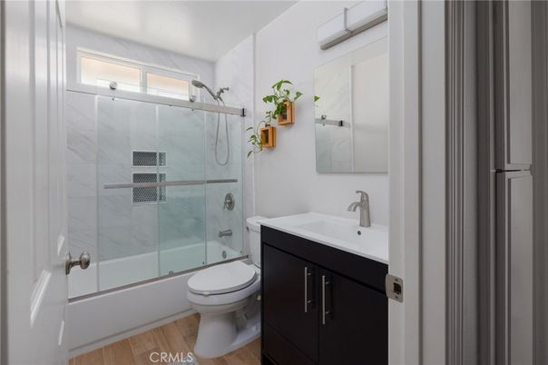 Bathroom, Glass Shower, Interior, Marble Walls, Wood Texture Flooring