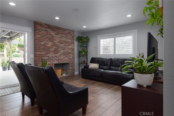 Fireplace, Interior, Living room, Recessed Lighting, Stone Walls, Wood Texture Flooring