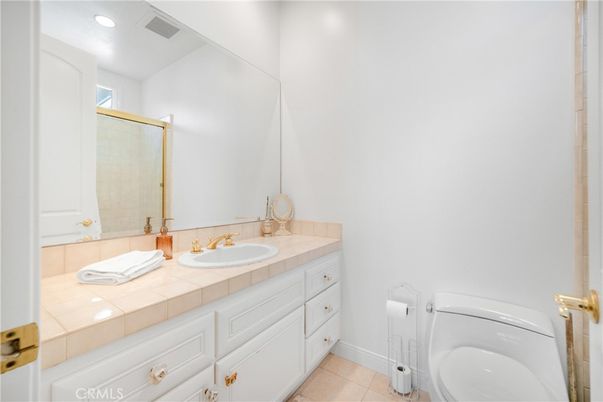 Bathroom, Dual Sink Vanities, Interior, Recessed Lighting, Tile Countertops