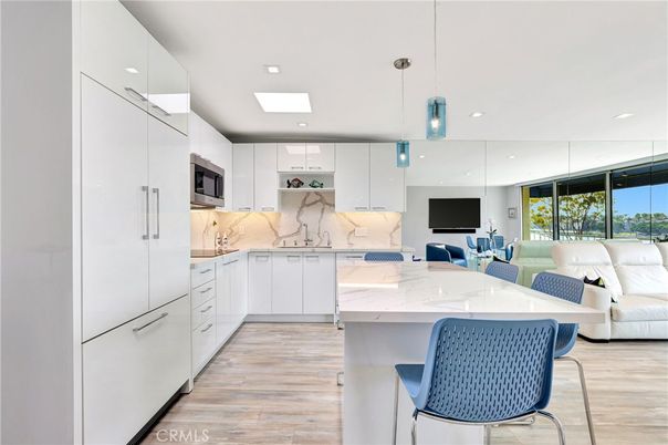 Interior, Kitchen, Living room, Marble Walls, Pendant Lights, Recessed Lighting, Stainless Steel Appliances, Wood Texture Flooring