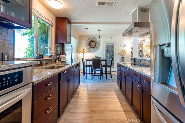 Dining room, Interior, Kitchen, Pendant Lights, Stainless Steel Appliances, Wood Texture Flooring