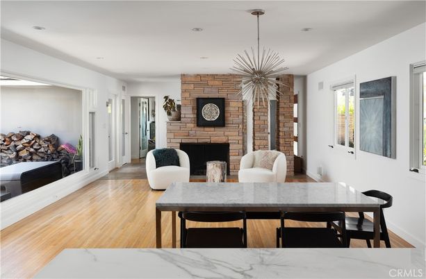 Dining room, Fireplace, Interior, Pendant Lights, Recessed Lighting, Stone Walls, Wood Texture Flooring