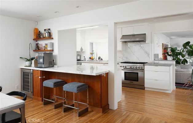 Interior, Kitchen, Marble Walls, Recessed Lighting, Stainless Steel Appliances, Wood Texture Flooring