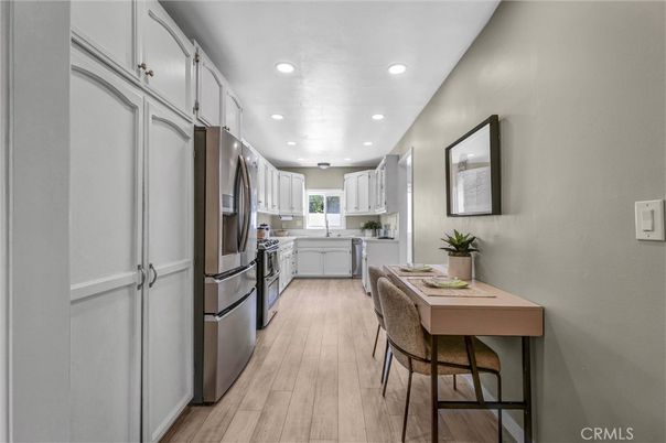 Dining room, Interior, Kitchen, Recessed Lighting, Stainless Steel Appliances, Wood Texture Flooring