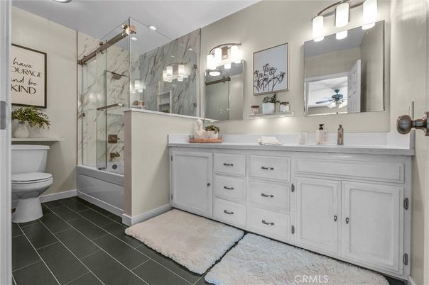 Bathroom, Dual Sink Vanities, Glass Shower, Interior, Marble Walls, Recessed Lighting