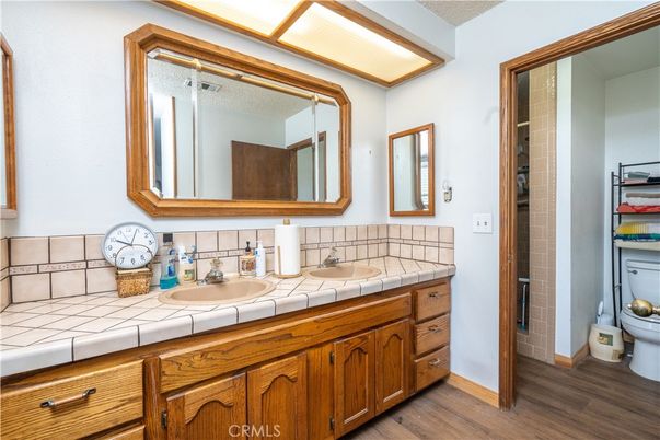 Bathroom, Dual Sink Vanities, Interior, Tile Countertops, Wood Texture Flooring