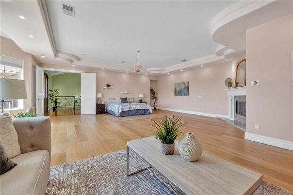 Bedroom, Fireplace, Interior, Pendant Lights, Recessed Lighting, Wood Texture Flooring