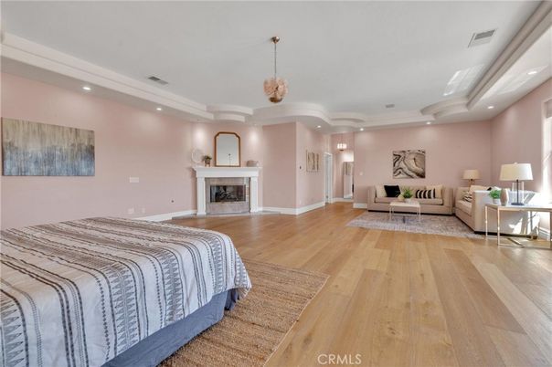 Bedroom, Fireplace, Interior, Pendant Lights, Recessed Lighting, Wood Texture Flooring