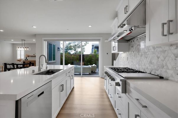 Dining room, Interior, Kitchen, Living room, Pendant Lights, Recessed Lighting, Stainless Steel Appliances, Wood Texture Flooring