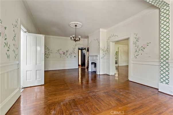 Chandelier, Empty room, Fireplace, Interior, Washer, Wood Texture Flooring