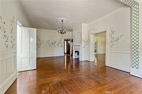 Chandelier, Empty room, Fireplace, Interior, Washer, Wood Texture Flooring