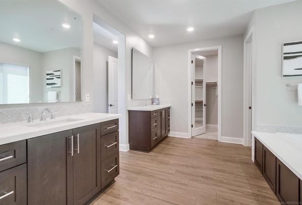 Bathroom, Dual Sink Vanities, Interior, Recessed Lighting, Walk-in Closets, Wood Texture Flooring