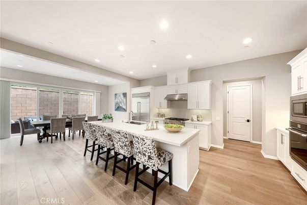 Dining room, Interior, Kitchen, Recessed Lighting, Stainless Steel Appliances, Wood Texture Flooring