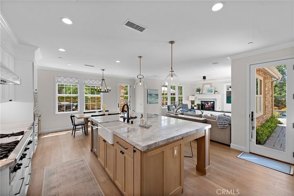 Dining room, Fireplace, Interior, Kitchen, Living room, Pendant Lights, Recessed Lighting, Stainless Steel Appliances, Wood Texture Flooring