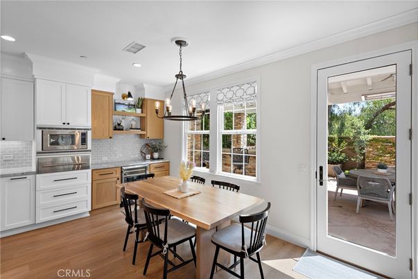 Dining room, Interior, Kitchen, Pendant Lights, Recessed Lighting, Stainless Steel Appliances, Wood Texture Flooring