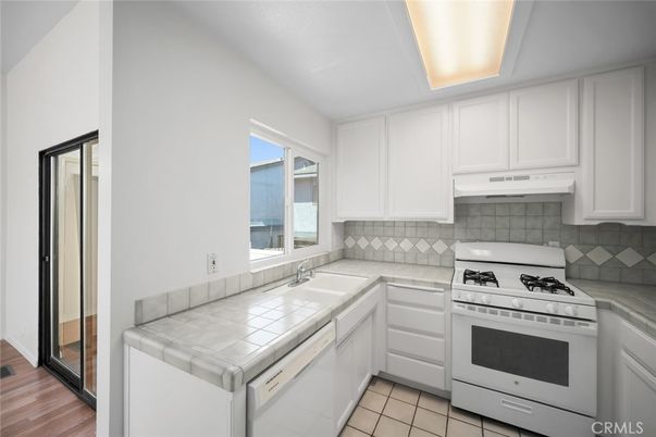 Interior, Kitchen, Tile Countertops, Wood Texture Flooring