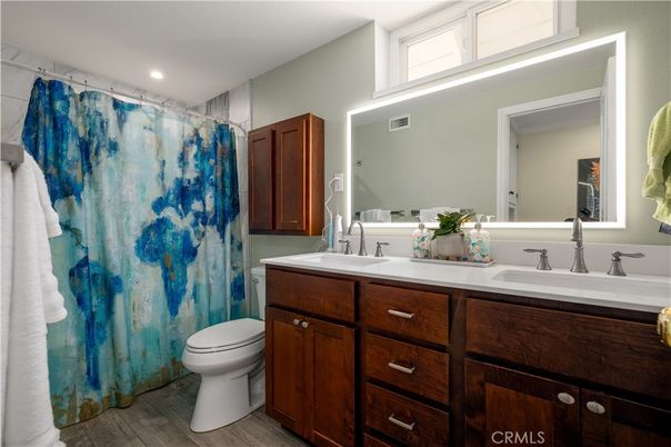 Bathroom, Dual Sink Vanities, Interior, Recessed Lighting, Wood Texture Flooring