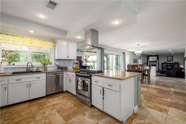 Chandelier, Dining room, Fireplace, Interior, Kitchen, Recessed Lighting, Stainless Steel Appliances