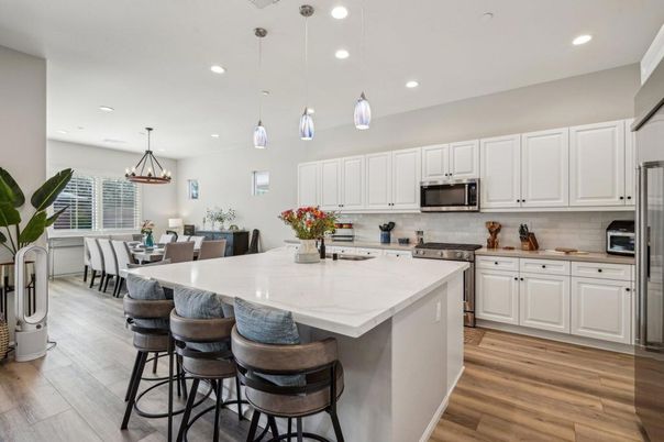 Dining room, Interior, Kitchen, Pendant Lights, Recessed Lighting, Stainless Steel Appliances, Wood Texture Flooring