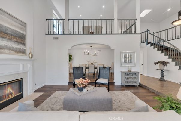 Chandelier, Dining room, Fireplace, Interior, Living room, Recessed Lighting, Wood Texture Flooring